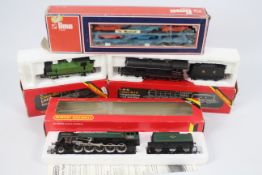 Hornby, Lima - Three boxed OO gauge Hornby locomotives and a boxed Lima OO gauge car transporter.