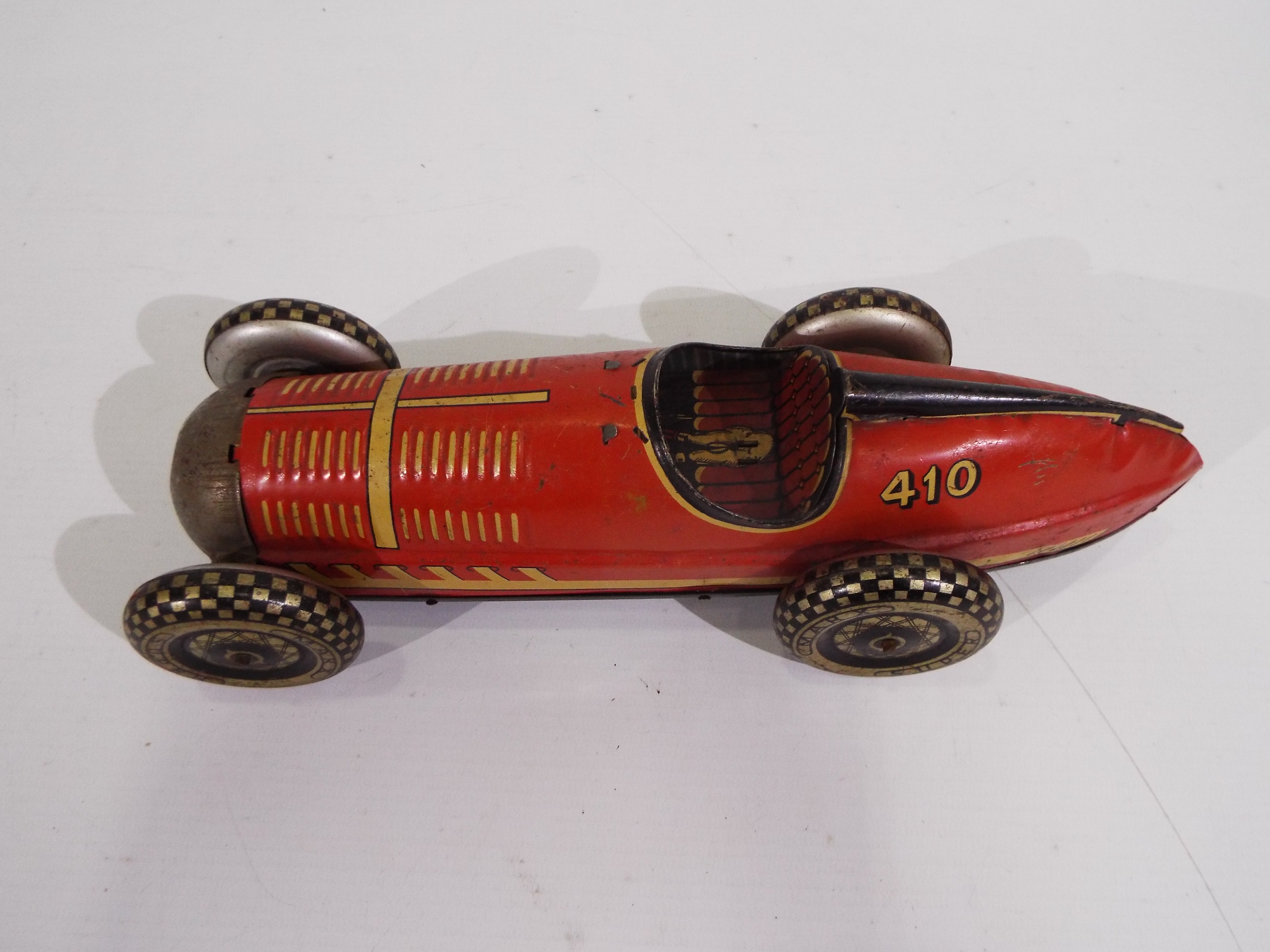 Marx - A clockwork pressed metal Marx Super Racer No. 410 in red with black trim. - Image 3 of 6