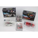 Takara, Tomy - Two boxed Transformers Masterpiece series figures.