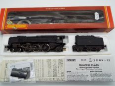 Hornby - an OO gauge model Britannia class 4-6-2 locomotive and tender,