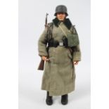 Dragon - An unboxed Dragon WWII German Forces 1:6 scale German Wehrmacht Soldier wearing greatcoat.