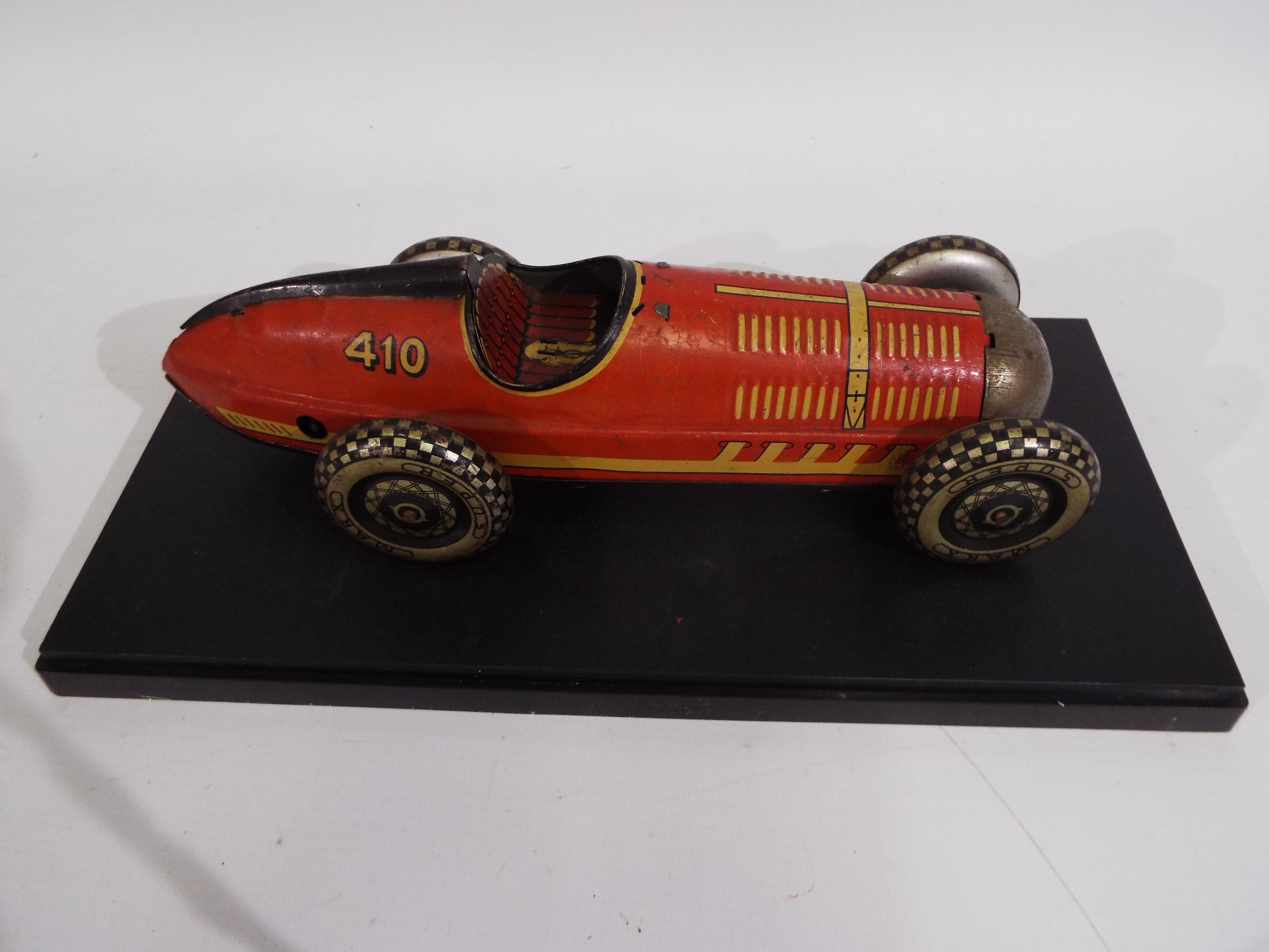 Marx - A clockwork pressed metal Marx Super Racer No. 410 in red with black trim. - Image 2 of 6