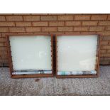 Two wall mounted display cabinets with glass shelves each measuring approximately 63cms (H) x 63cms