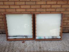 Two wall mounted display cabinets with glass shelves each measuring approximately 63cms (H) x 63cms
