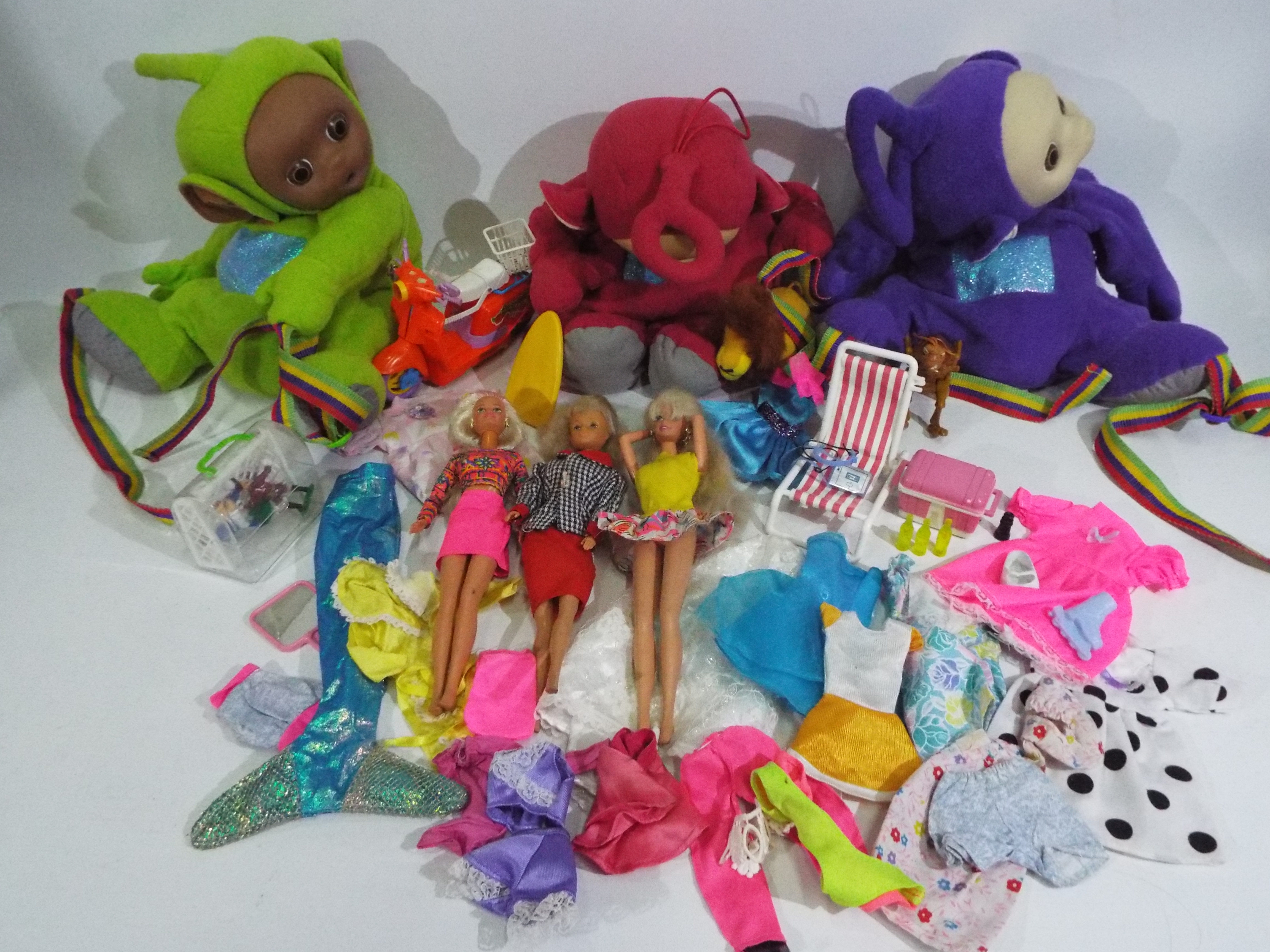 Mattel, Hasbro, Teletubbies - Two Barbie dolls, an unknown maker doll, and Barbie accessories,