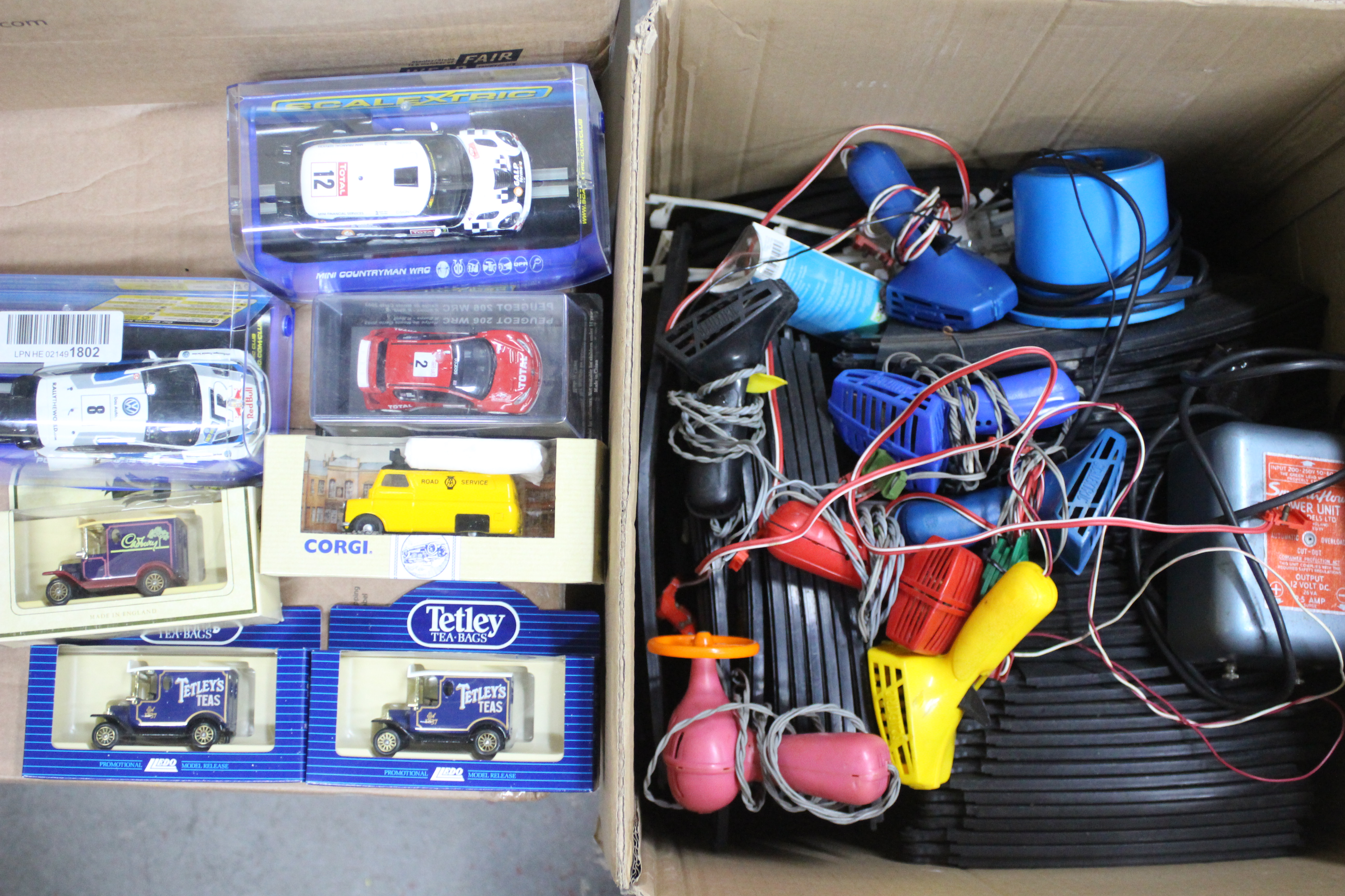 Scalextric - Two boxed Scalextric slot cars with a large quantity of Scalextric track,