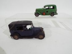 Tri-ang - Minic - 2 x clockwork pressed metal Minic vehicles, a Ford Y Saloon and a London Taxi.