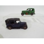 Tri-ang - Minic - 2 x clockwork pressed metal Minic vehicles, a Ford Y Saloon and a London Taxi.