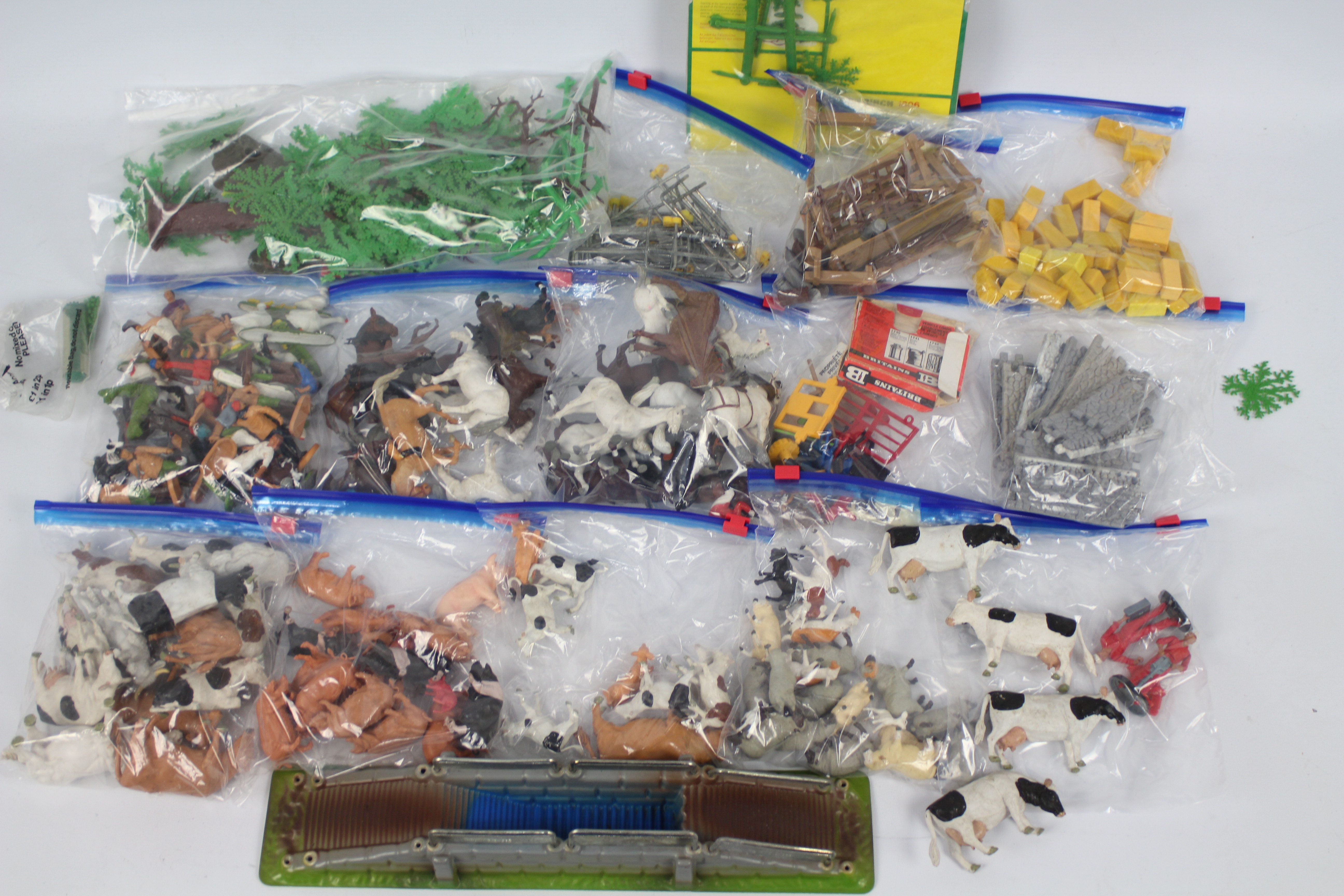 Britains - A large loose collection of Britains plastic farm animals, workers, and accessories.