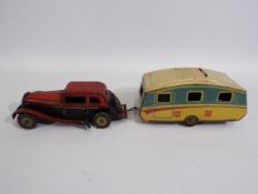 Mettoy - A vintage clockwork tinplate Saloon car and Caravan.