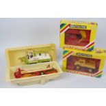Britains - Two boxed and two part boxed Britains 1:32 scale vehicles / implements.