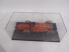 Marx - A clockwork pressed metal Marx Super Racer No. 410 in red with black trim.