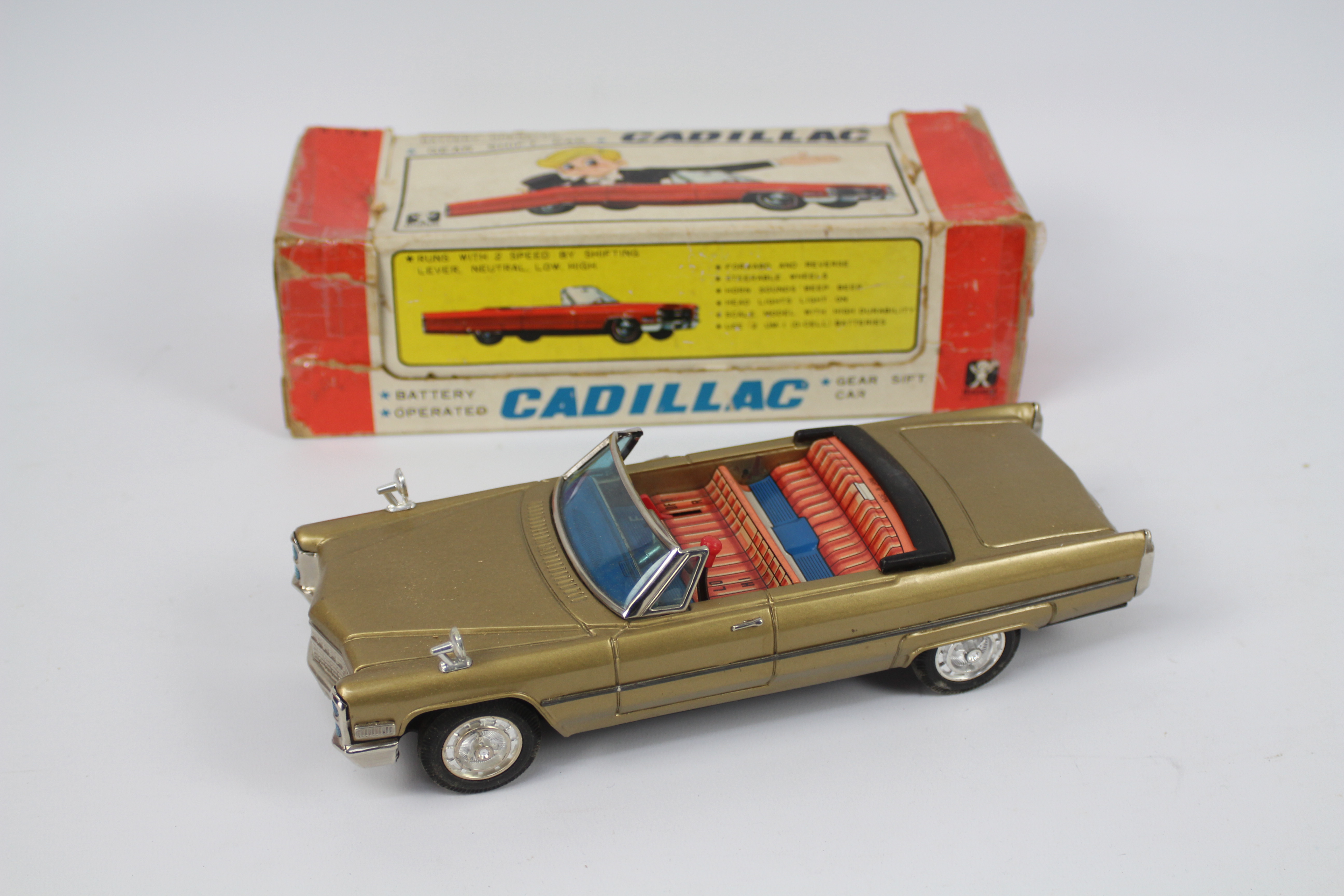 Bandai - A boxed battery powered pressed metal Cadillac Gear Shift Car # 4102.