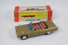 Bandai - A boxed battery powered pressed metal Cadillac Gear Shift Car # 4102.