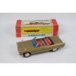 Bandai - A boxed battery powered pressed metal Cadillac Gear Shift Car # 4102.