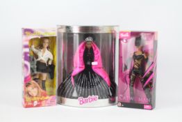 Barbie - Britney Spears - Catwoman - Happy Holidays. A selection of 3 Barbie dolls.