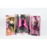 Barbie - Britney Spears - Catwoman - Happy Holidays. A selection of 3 Barbie dolls.