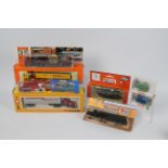 Herpa, Wiking, Cox, Roco - A boxed grouping of HO scale plastic vehicles.