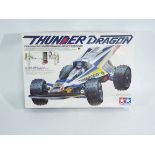 Tamiya - A boxed 1/10 scale Tamiya 'Thunder Dragon' R/C car - R/C car comes in an