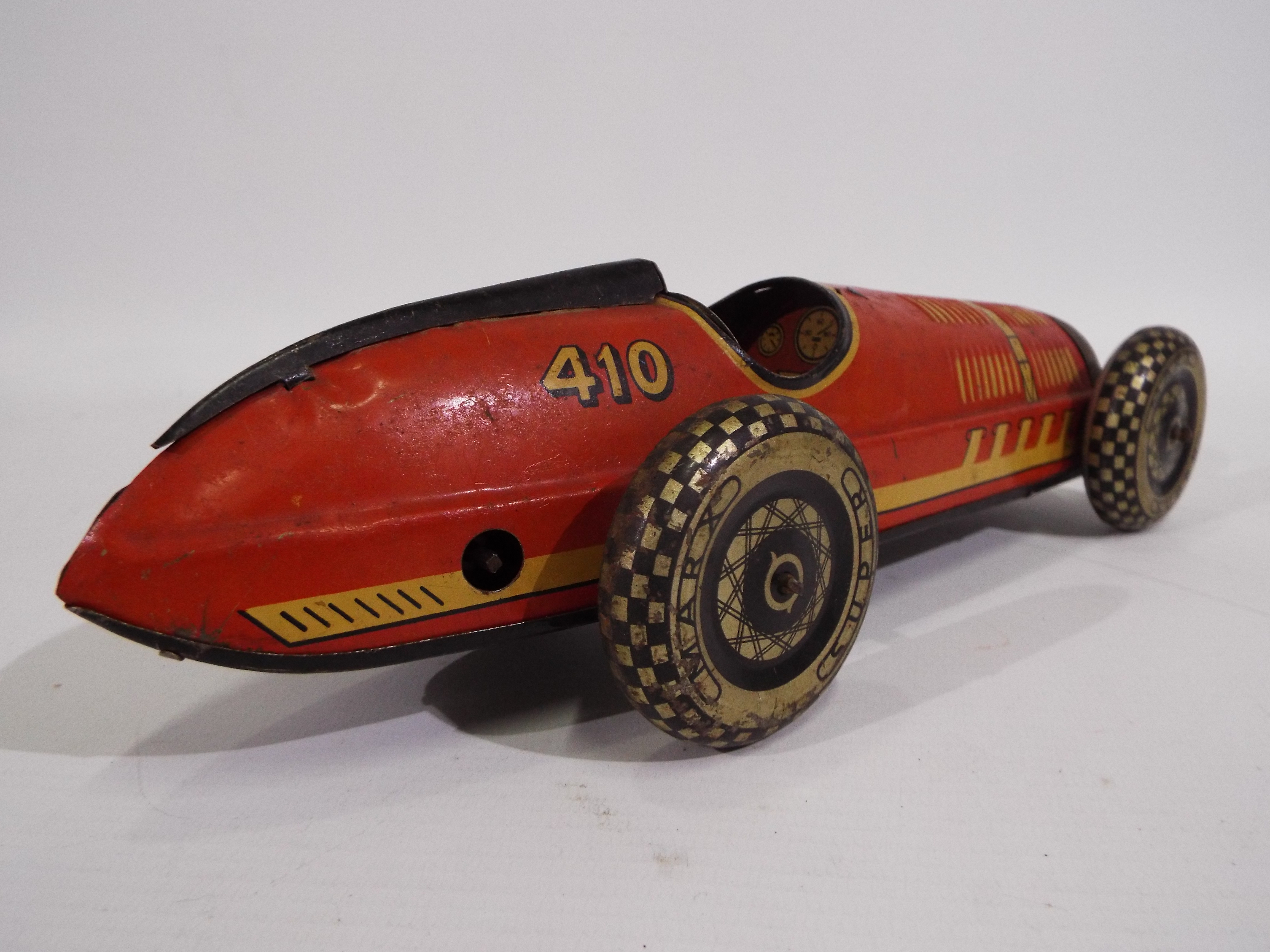 Marx - A clockwork pressed metal Marx Super Racer No. 410 in red with black trim. - Image 6 of 6