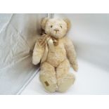 Merrythought - a very large blonde Bear with growler,