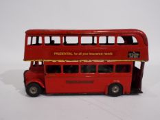 Tri-ang - Minic - A 1950s pressed metal London Bus with flywheel motor.