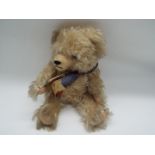 Hermann - a blonde mohair Bear by Hermann with growler,