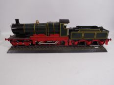 Unknown Maker - A large plastic kit built motorised 4-4-0 steam locomotive which measures 72 cm in