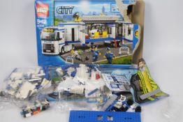 Lego - a Lego City set 5 - 12 #60044, box is open containing a sealed bag and open bags,