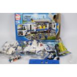 Lego - a Lego City set 5 - 12 #60044, box is open containing a sealed bag and open bags,