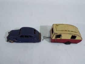 Tri-ang - Minic - A clockwork pressed metal Chrysler Airflow car and a Caravan.
