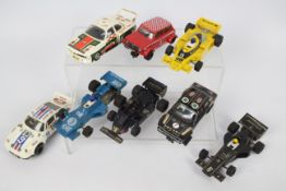 Scalextric - A collection of eight unboxed vintage Scalextric slot cars.