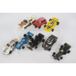 Scalextric - A collection of eight unboxed vintage Scalextric slot cars.