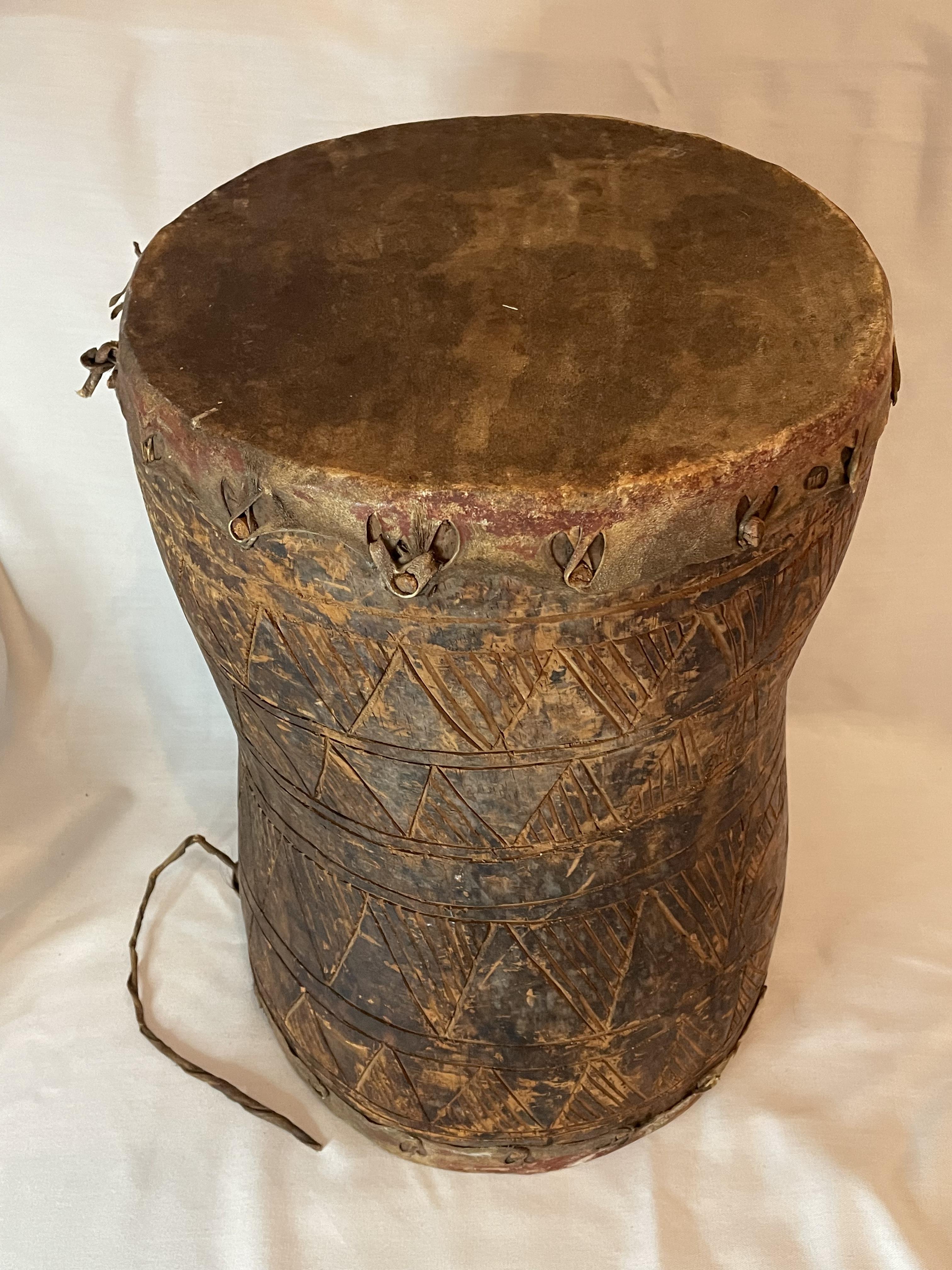 TRIBAL ART - AFRICAN CARVED WOOD AND GOAT SKIN CEREMONIAL DRUM