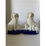 19TH CENTURY PAIR OF STAFFORDSHIRE POTTERY POODLES WITH PUPS