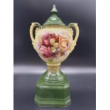 An Antique A.G. Harley Jones, Royal Vienna ceramic vase. Hand-painted floral design with an