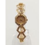 AN 18K GOLD LADIES COCKTAIL WATCH WITH DIAMOND BEZEL AND FACE AND HALF DIAMOND STRAP. 16MM. 26.51g