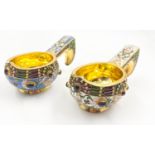 2 RUSSIAN SILVER GILT ENAMELLED KOVSH . 166gms total weight, 10cms