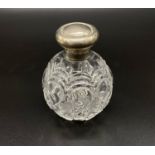 Antique Silver-Topped Cut Glass Scent Bottle. Synyer and Beddoes of Birmingham Hallmark. 12cm tall.