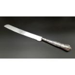 A Vintage Harrison Brothers of Sheffield Silver Bread Knife. 31cm long. 41g