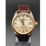 A Ladies Rolex Oyster Perpetual Datejust. 18k Yellow Gold Case - 26mm. Gold-tone dial. Brown leather