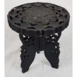 An Antique, small decorated wooden stool. Possibly of Burmese origin. 26cm high.