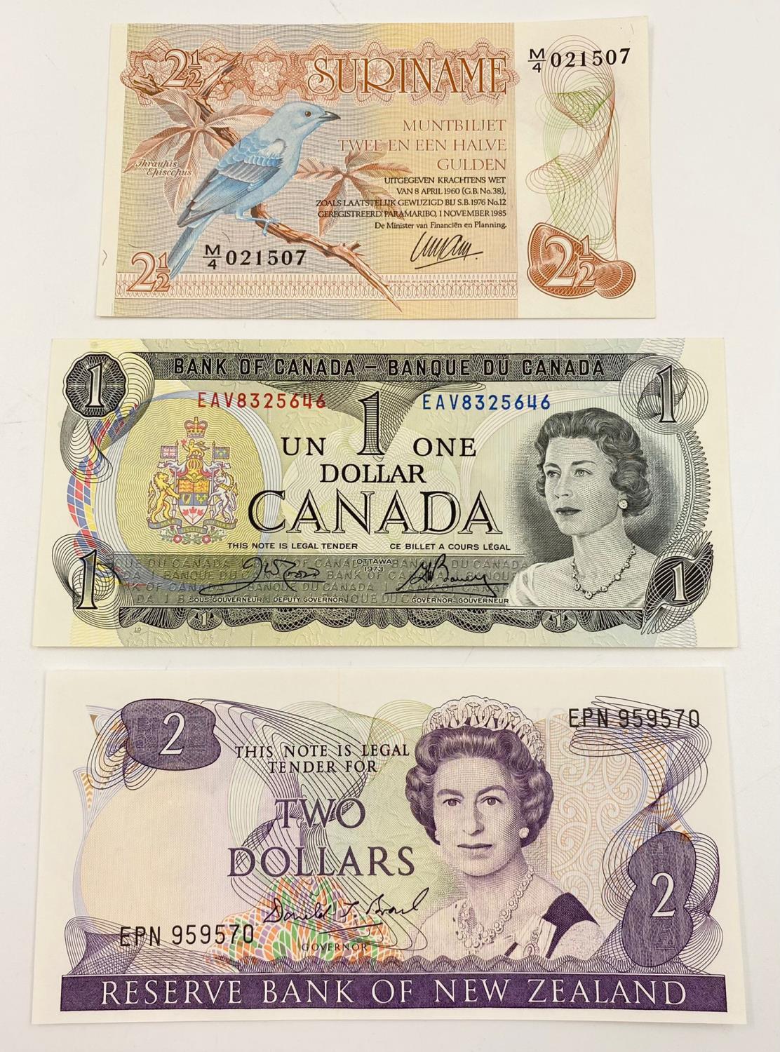Three Vintage Uncirculated Banknotes - Canada. New Zealand and Suriname.