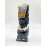 A Hand-Carved Obsidian Mayan Aztec God Figurine with Inlaid Mother of Pearl and other semi-