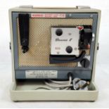 A vintage, portable, Kodak Brownie 8 projector in very good condition.