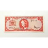 A 1964 Trinidad and Tobago One Dollar Note. Very fine - bordering on uncirculated condition. In
