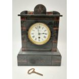 A Vintage Mantel Clock. Inlaid dial and movement encased in a heavy metal case. Markings for C.Day -