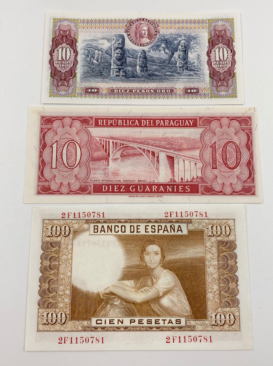 Three Vintage Uncirculated Bank Notes - Colombia, Paraguay and Spain.