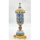 A RUSSIAN SILVER GILT AND ENAMEL LIDDED VASE WITH LION FEET AND SET WITH GEMSTONES. 558gms 26cms
