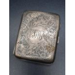 A Birmingham 1919 Hallmarked Silver Cigarette Case. Engraved decoration. A few signs of wear. A/F.